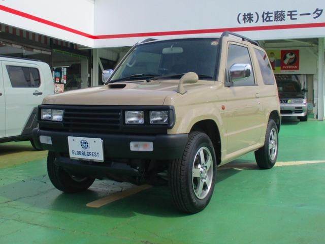 Mitsubishi PAJERO MINI 2010 — фото автомобиля 1
