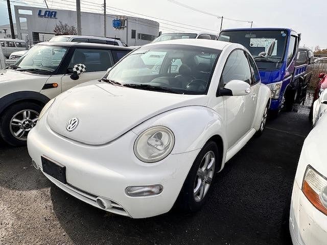 Volkswagen NEW BEETLE 2004 — фото автомобиля